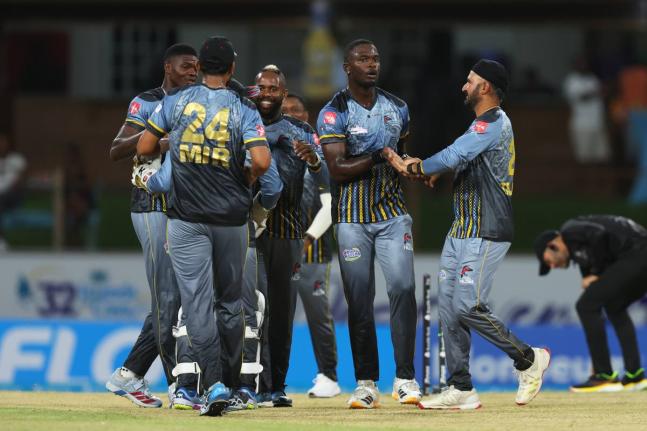CPL T20/ SmartFrame 
Antigua and Barbuda Falcons celebrate during their nail-biting two-wicket win over Jamaica Kingsmen in the opening match of the Caribbean Premier League (CPL) at Arnos Vale in St Vincent on Friday.
