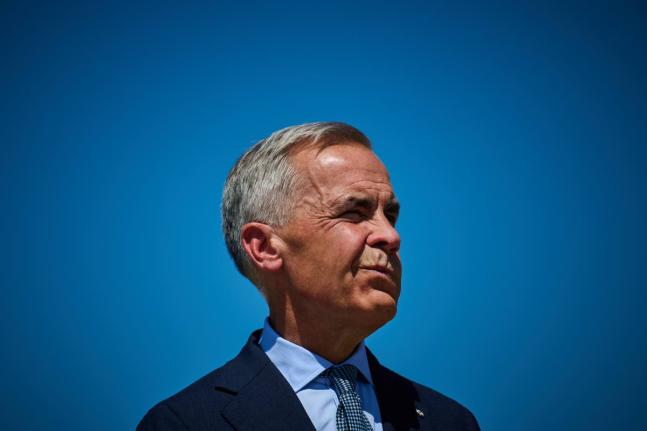 Prime Minister Mark Carney attends a housing announcement in Toronto.