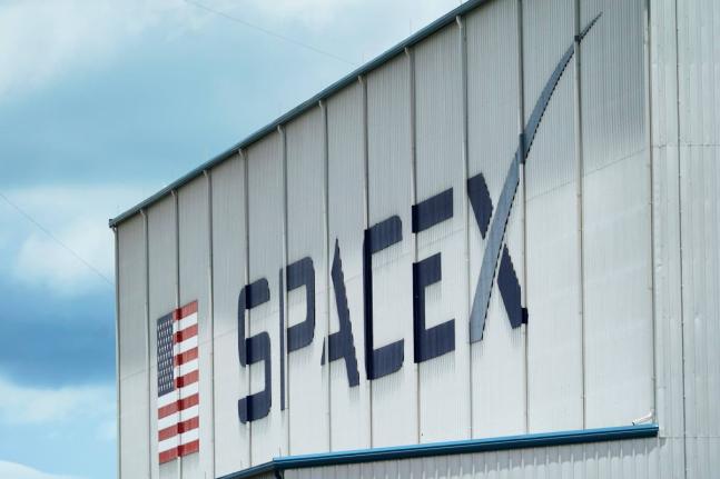 The SpaceX logo is displayed on a building in May 2020 at the Kennedy Space Center in Cape Canaveral, Florida.  