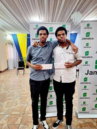 Twin brothers Romaine (left) and Rakeem Henry at Jamalco’s Education Assistance Awards Ceremony at the Wembley Centre of Excellence in Hayes, Clarendon, on July 29.