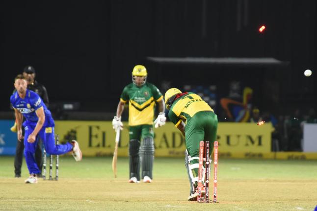 Jamaica Kingsmen’s Kirk McKenzie Jr (right) is bowled for a duck by DR Sams (left) from the Barbados Trident during their Caribbean Premier League T20 cricket match at Sabina Park on Tuesday.