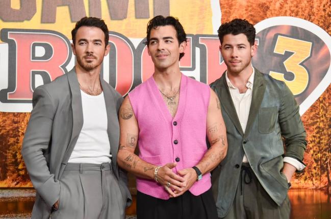 The Jonas Brothers (from left) Kevin Jonas, Joe Jonas, and Nick Jonas arrive at the premiere of ‘Camp Rock 3’ on Monday, August 10, at The Walt Disney Studios in Burbank, California. 