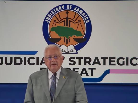 Minister of Justice and Constitutional Affairs, Delroy Chuck, addressing the Judiciary of Jamaica's annual Strategic Management Retreat, held at the AC Hotel by Marriott Kingston on August 17,2026.  