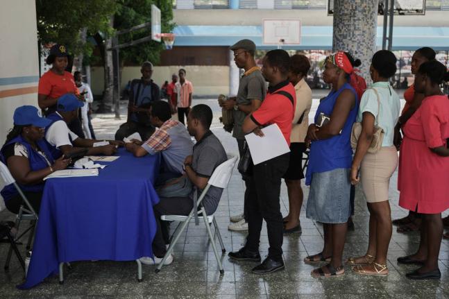 Haitians register to vote in the upcoming general election in Port-au-Prince, Haiti, Friday, July 31, 2026. (AP Photo/Odelyn Joseph)