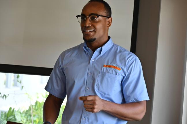 Clive Harris, group technical manager at Rainforest addressing scholarship recipients at the group’s headquarters in Montego Bay. 