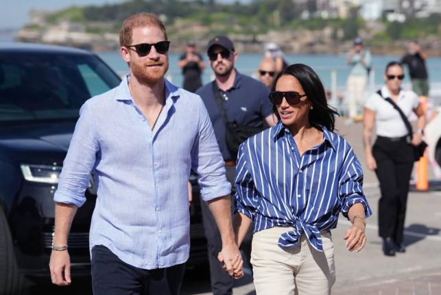 Prince Harry (left) and Meghan, the Duke and Duchess of Sussex. 