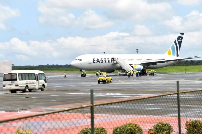 Plane carrying the deportees from the US arrives at the Roberts International Airport outside of Monrovia, Liberia, Thursday.