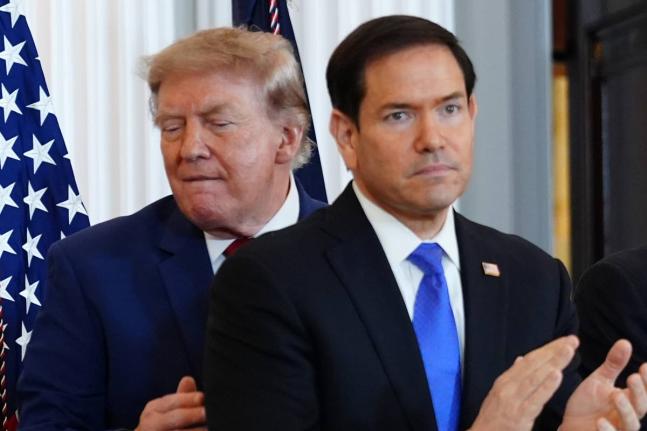 President Donald Trump walks past Secretary of State Marco Rubio as he arrives for a roundtable on the American mining industry on August 7 at the State Department in Washington. 