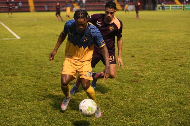 Mikyle Williams (left) of Racing United controls the ball as Marcos Filho of Chapelton Maroon moves in to tackle during a Jamaica Premier League match at the Anthony Spaulding Sports Complex last season.