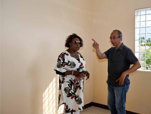 Minister of Culture, Gender, Entertainment and Sport, Olivia Grange, and Deputy Prime Minister and Minister of National Security and Peace, Dr Horace Chang, in discussion as they tour the newly completed third shelter for women experiencing abuse. - Contri