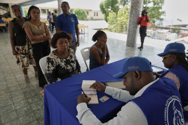 Haitians register to vote in the upcoming general election in Port-au-Prince, Haiti, July 30.