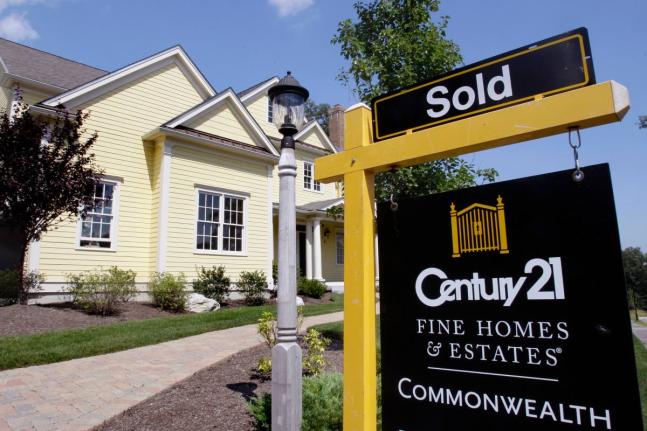 A sold sign posted outside a newly constructed house in Wellesley, USA on August 25, 2026. (AP Photo)