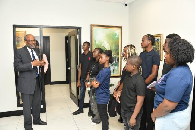 Earl Jarrett, chief executive officer of the JN Group, speaks with participants in the Valda Mae Cares Foundation’s (VMCF) NextGen Leadership Programme during their visit to the JN Group Corporate Offices in New Kingston recently. 
