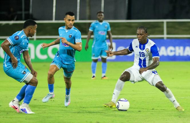 Mount Pleasant Football Academy’s Warner Brown (right) controls the ball as he faces three Salcedo FC opponents during the Caribbean Club Championship football match in the Dominican Republic on Wednesday. The game ended 1-1.