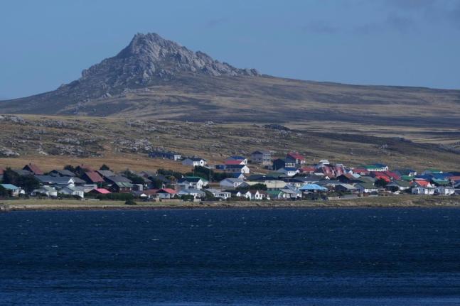 Mount Tumbledown stands tall behind Stanley on the Falkland Islands, also known as Islas Malvinas, March.