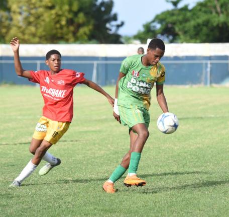 Ocho Rios High’s Dario James (right)  tries to outrun Old Harbour High’s  Dimell White during their opening match of the ISSA Ben Francis Cup KO round one match at Drax Hall Sports Complex  on Friday, December 12, 2025.