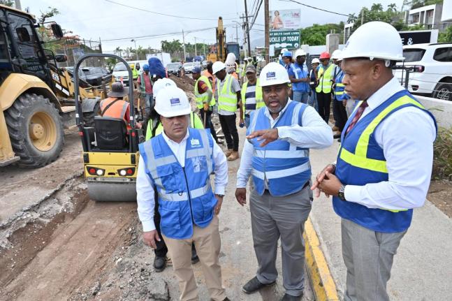 Matthew Samuda (left), minister of water, environment and climate change; Kevin Kerr (right), president of the National Water Commission (NWC); and Gary Walters (centre), senior project manager, take part in a tour on Tuesday of the pipeline project curren