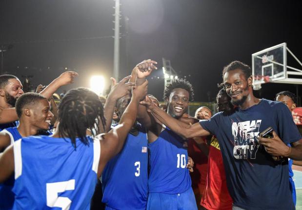 Kemar Dennis of the Majesty Gardens Legends celebrates a game winning three-pointer, with the team securing game one of three with a score of 68-66 against the Caribbean Basketball Academy at the GKONE Howard McCatty Community Basketball League at the stad