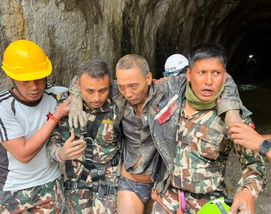 
In this photo provided by the Nepal Army, a Chinese national is seen after being rescued by soldiers during an ongoing operation at the Trishuli-3A hydropower project in Nepal’s Rasuwa district, Saturday. 