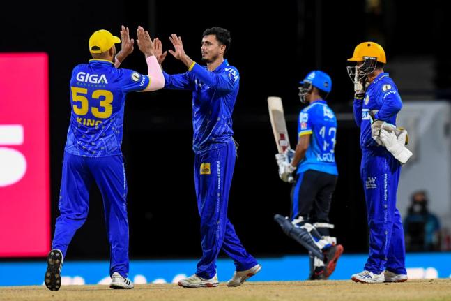 Thee Barbados Tridents’ Brandon King (left), Mujeeb ur Rahman (centre), and Tim Seifert (right) celebrate the wicket of St Lucia Kings opener Kamil Pooran during their Republic Bank Caribbean Premier League game at the Kensington Oval on Sunday.