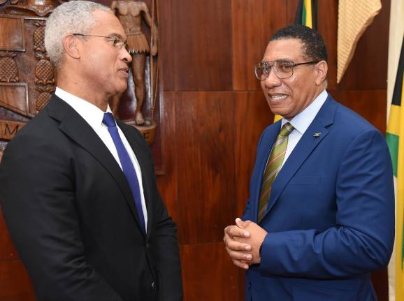 Prime Minister Dr Andrew Holness (right) chats with Professor Peter Blair Henry (left), Chair of the Jamaica Reconstruction and Resilience Oversight Committee (JAMRROC) during the official launch at Jamaica House on Tuesday. – Ian Allen photo