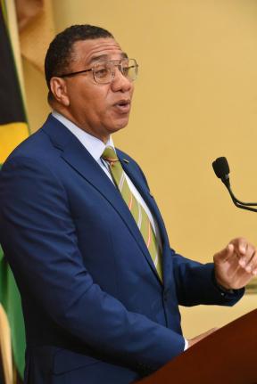 Prime Minister Dr Andrew Holness addresses the audience during the official launch of the Jamaica Reconstruction and Resilience Oversight Committee on Tuesday. 