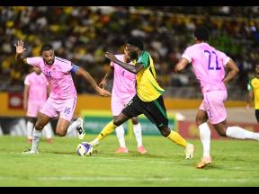 Credit: Gladstone Taylor Reggae Boy Shamar Nicholson (second from right) in action against Bermuda’s Dante Leverock (left) during the Jamaica versus Bermuda World Cup Qualifier at the National Stadium on Tuesday, October 14.