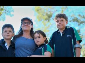 This image taken from video shows Austin Appelbee, right, posing with his family in Gidgegannup, Australia, Tuesday February 3, 2026. (ABC via AP)