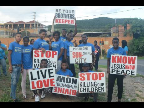 A group from the Lef Wrong Do Right team showcasing placards used during their march last year.