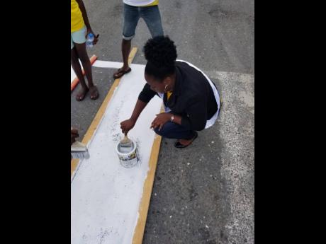Olecia Robinson taking part in the Labour Day project which took place at the Fair Prospect Primary School  in Portland.