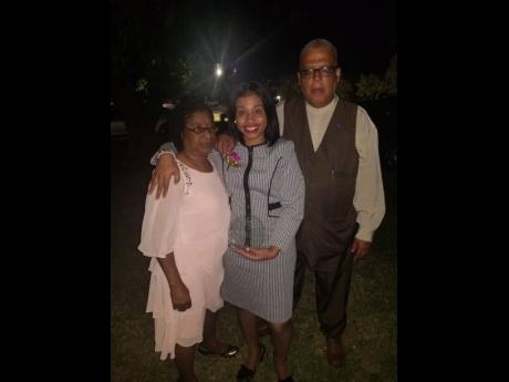 
Sasha-Gaye (centre) with her mother, Poncella Medley-Belnavis, and father, Anthony.