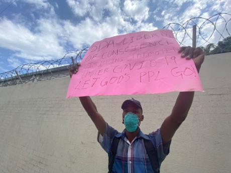 Jessie Justin, a member of the Tent City Seventh-Day Adventist Church, protesting in front of The Gleaner against the designation of Saturday as a shopping day under the St Catherine lockdown.