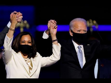 Vice-President-elect Kamala Harris holds hands with President-elect Joe Biden. 