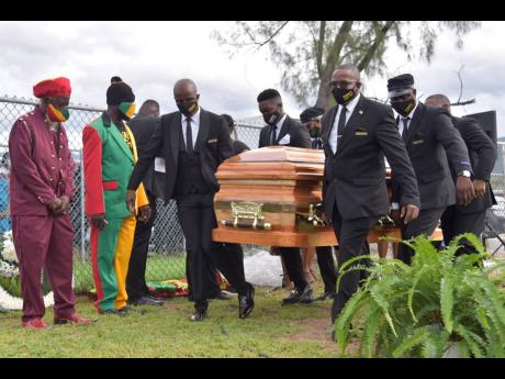 Pall-bearers carry the coffin bearing the body of late reggae icon, Frederick ‘Toots’ Hibbert during the interment service at the National Heroes Park in Kingston on Sunday. Hibbert’s daughter, Jenieve Hibbert-Bailey, said she is happy her father got