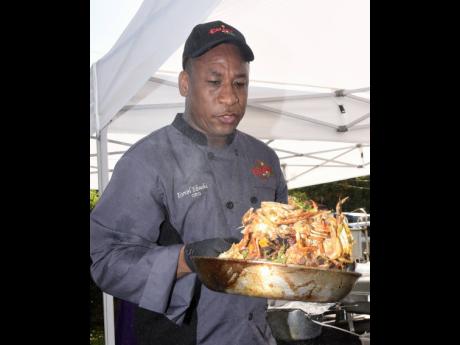 Chef Ebanks is caught in action during a live demonstration.
