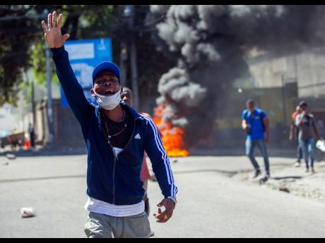 Credit: AP A protester chants anti-government slogans to demand the resignation of Haiti’s president Jovenel Moïse in Port-au-Prince, Haiti, Wednesday, February 10. Haiti has lurched into fresh political crisis amid allegations of a coup attempt and an escalating