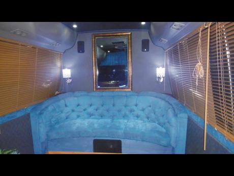 A sofa built into a bus. 