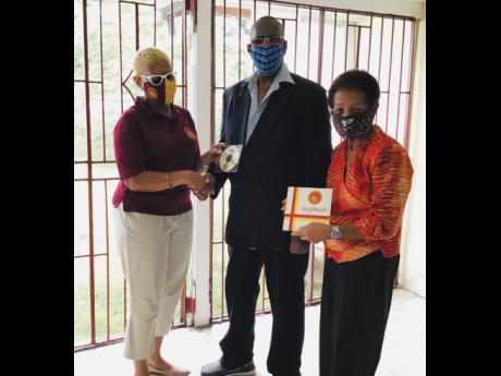 
From left: Yolette Barnett, president of Wolmer’s Girls’ Alumnae; Neville Hinds, engineer for the recording of the song; and Norma Brown Bell, producer.