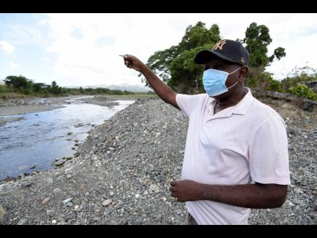 Gauntlet Stewart, a resident of Seaforth Gardens in St Thomas, explains how high the level of the Negro River rose the last time the community got flooded.