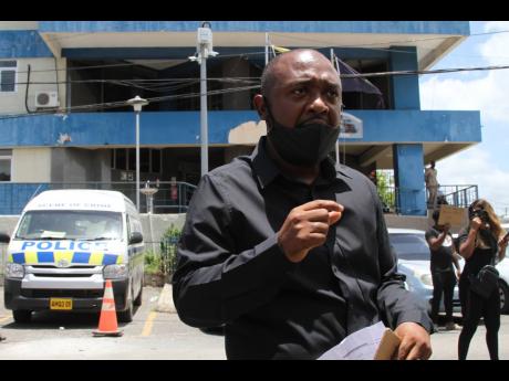 Credit: Nathaniel Stewart Denton Atkins is president of the Clarendon Promoters Association which led a peaceful demonstration outside the May Pen Police Station in the parish last Sunday.