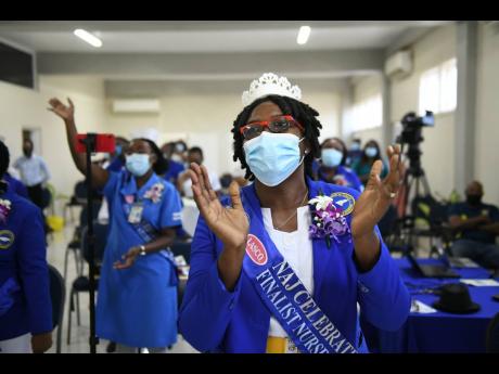 Nurse Lillian Lewis-McDonald participates in praise and worship at the Nurses Association of Jamaica’s Nurses Week church service at the Mary Seacole House, St Andrew, on Sunday, July 18.