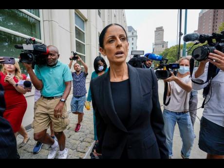 R Kelly’s attorney, Nicole Blank Becker, is surrounded by reporters as she arrives at the Brooklyn Federal Court for opening statements in the R&B star’s long-anticipated federal trial arising from years of allegations that he sexually abused women and
