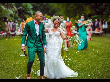The Robinson do a happy dance down the aisle after saying their 'I dos'.