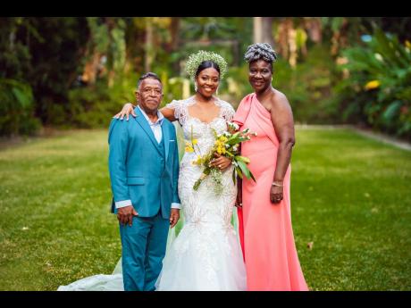 The bride is flanked by her parents Denton and Shirley Copeland. 