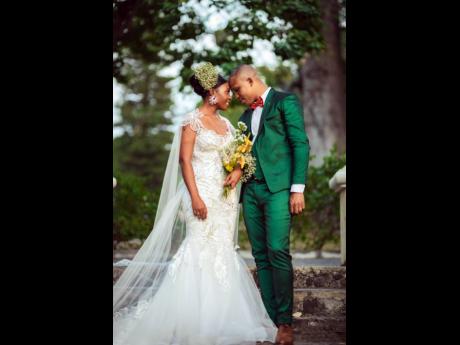 Mercy-Ann Copeland Robinson and Brandon Robinson are one with nature and each other as they stroll down the steps of the Sunken Garden in Hope Botanic Gardens, where they had their first official date. 