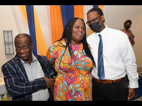 Keith and Annette Irving celebrate with their son, valedictorian Oral Irving.