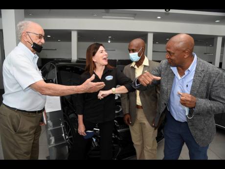 From left: Head of the Carifta Games’ local organisation committee, former Jamaica Olympic Association (JOA) president, Mike Fennell; Diana Stewart, chairman, Stewart’s Automotive Group; Garth Gayle, president, Jamaica  Athletics Administrative Associa