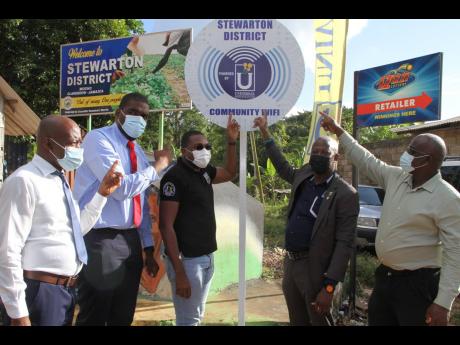 Credit: Nathaniel Stewart Celebrating the occasion of community Wi-Fi in Mocho, Clarendon, are (from left) Ainsworth Kelly, guidance counsellor, Lennon High School; Romaine Morris, councillor, Mocho Division; Robert Morgan, member of parliament, Clarendon North Central; Daniel Dawe