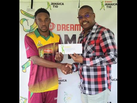 
Middlesex Titans spinner Chevonie Grant (left) accepts the man-of-the-match award from Jamaica Cricket Association CEO Courtney Francis after his four for nine helped his side get over the line against the Middlesex United Stars in their Dream 11 JCA T10 
