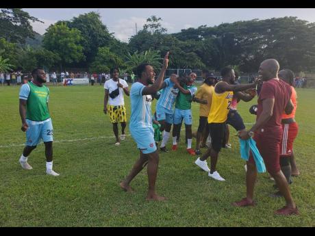 Members of the Faulkland FC team celebrate after gaining promotion to the Jamaica Premier League following their win over Falmouth United in the semi-finals of the Jamaica Football Federation Tier Two competition at Drax Hall on Sunday, July 24. 